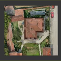Traditional Detached Villa Exterior With Red Roof Green Trees And Garden Area