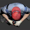 Worker In Blue Overalls Gray T-shirt Red Cap Knee Pads Standing Against Gray Background