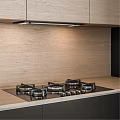 Modern Kitchen Interior With Black And Light Wood Cabinets Countertop Sink And Oven