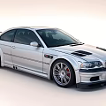 Silver BMW Performance Sports Car With Aerodynamic Design Alloy Wheels Hood Vents And Rear Spoiler