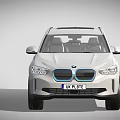 White BMW Electric SUV With Modern Design Black Wheels And Blue Accents
