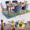 Wooden Dining Table and Blue Chairs With Colorful Rug Lemon Water Pitcher Glassware and Napkins