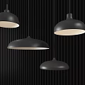 Four Black Dome Shaped Pendant Lights With White Light Hanging Against Black Vertical Striped Background