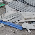 Pile of Scrap Metal Featuring Corrugated Iron Sheets Broken Panels And Wooden Pieces
