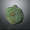 Green Textured Weapon With Two Golden Circular Elements And Surface Details