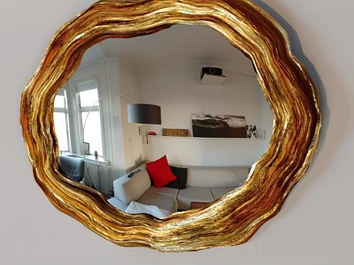 Round Gold Mirror With Wavy Frame Reflecting Sofa Red Cushion And Window 3d model