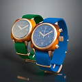 Fashionable Watches With Green And Blue Straps Metallic Dials And Golden Frames Design