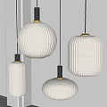 Three Pleated Pendant Lights with White Lampshades and Black Bases Hanging