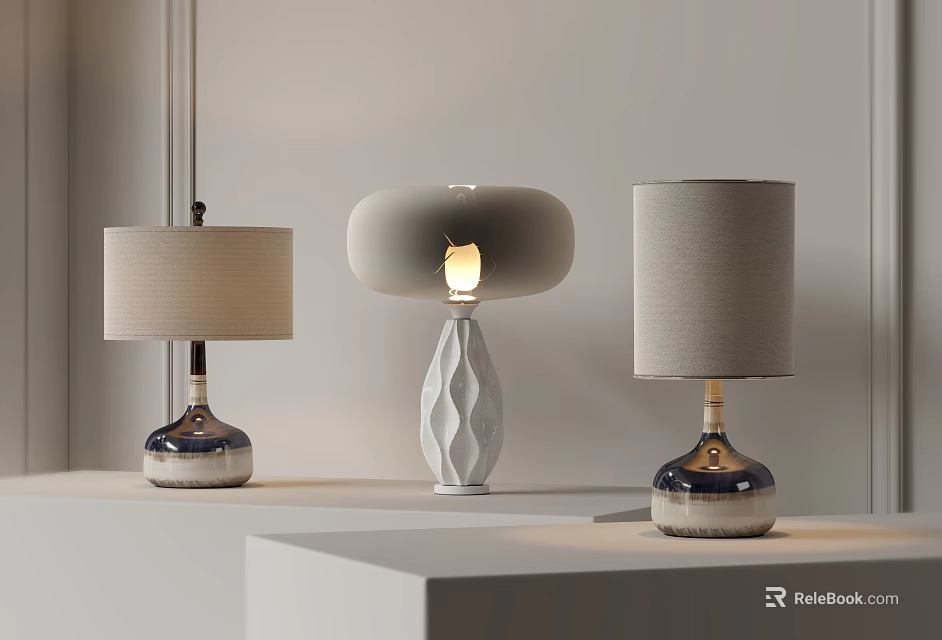 Three Contemporary Table Lamps with Cylindrical Round Shades and Illuminated Geometric Base on White 3d model 