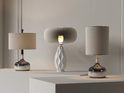 Three Contemporary Table Lamps with Cylindrical Round Shades and Illuminated Geometric Base on White 3d model