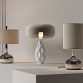 Three Contemporary Table Lamps with Cylindrical Round Shades and Illuminated Geometric Base on White