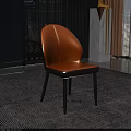 Modern Orange Leather Dining Chair With Black Metal Legs On Carpeted Floor
