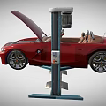 Red Convertible Car With Open Hood Elevated On Hydraulic Car Lift