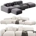 Cozy Modern Sectional Sofa With Soft Pillows And Throw Blanket In Neutral Tones