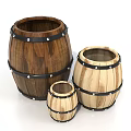 Three Wooden Barrels in Different Sizes with Metal Hoops and Rustic Design