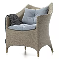 Beige Woven Leisure Chair With Light Blue Cushions Dark Blanket And Metal Legs