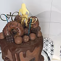 Chocolate Cake With Drizzle Toppings Golden Decor On Glass Stand And Geometric Background