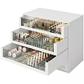 White Drawer Cosmetic Organizer Filled With Perfumes And Makeup Products