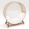 Comfortable Round Rattan Outdoor Chair With White Cushion And Wooden Legs