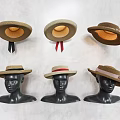 Stylish Wide Brim Hats Displayed On Black Mannequin Heads With Ribbons