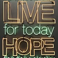 Decorative Lights Forming Learn from Yesterday Live for Today Hope for Tomorrow on Gray Wall