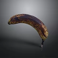 Close Up Image Of Overripe Banana With Brown Spots On Gray Background
