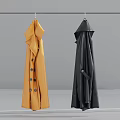 Stylish Yellow and Black Trench Coats Hanging with Classic Button Details