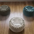 Round Fabric Footstools In Neutral Tones On Wooden Floor Home Decor