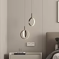 Modern Circular Pendant Lights In Bedroom With Nightstand Books And Glass