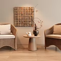 Cozy Rattan Leisure Chairs With Beige Cushions Small Wooden Table Vase And Patchwork Wall Decor