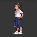 Little Girl In White Top And Blue Skirt Standing On Reflective Floor With Gray Background