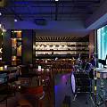 Modern Bar Interior Design With Hanging Chandeliers Round Tables And Stools