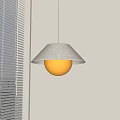 Modern Pendant Light Featuring Fabric Shade And Round Globe In Light Colored Room