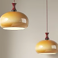 Two Modern Amber Gradient Pendant Lights With Red Top Illuminated In Interior 3d model