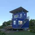 Blue Two Story Container House With Wooden Deck Outdoor Furniture And RV In Green Surroundings