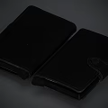 Two Black Books With Leather Covers And Simple Elegant Design Styles