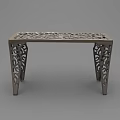 Intricately Carved Metal Coffee Table With Ornate Legs And Decorative Top Surface