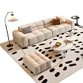 Modern Beige Sofa And Coffee Table Set With Black White Spotted Rug And Brown Armchair