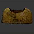 Traditional Golden Armor Accessory With Intricate Engraved Patterns And Historical Design