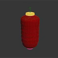 Red Decorative Lantern With Yellow Top Base And Lit Candle Wick