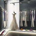 Elegant Bridal Dresses Hanging In Boutique With Mannequin And Colorful High Heels