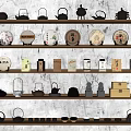 Traditional Tea Utensils Display with Teapots Teacups and Round Tea Cakes on Shelves