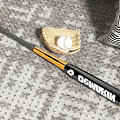 Baseball Sports Equipment Including Demarini Bat Glove And Two Balls On Carpet