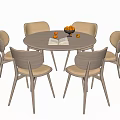 Round Dining Table Set with Six Light Wood Chairs Beige Cushions Fruit Bowl and Book