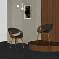 Modern Black Leather Dining Chairs With Wooden Legs Against Grey Walls And Artwork