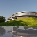 Modern Circular Hotel Building With Glass Facade Green Lawn And Water Reflection