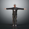 Man Wearing Cap Black Jacket With White Letters Gray Pants Arms Outstretched Gray Background