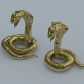 Two Golden Cobra Reptile Statues With Coiled Bodies And Raised Heads