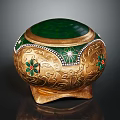 Golden Decorative Furniture Accent With Green Lid Ornate Patterns And Colored Gemstone Inlays