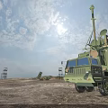 Military Missile Launch Vehicles In Open Field During Sunset With Cloudy Sky